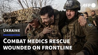 Medics on Ukraine frontline rescue wounded soldiers | AFP