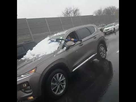 Woman Spotted Cleaning Her Windshield While Driving