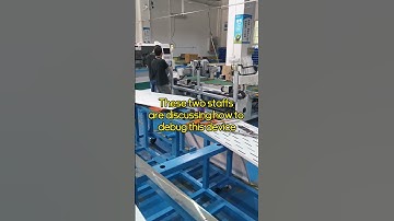 These two staffs are discussing how to debug this device