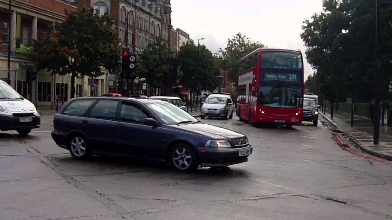 London Met Police car and van - traffic problem - Holloway Road