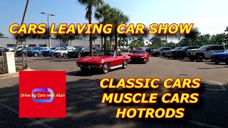 Cars leaving Car Show. Hotrods, classic and muscle cars.