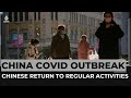 Chinese return to regular activities amid COVID surge