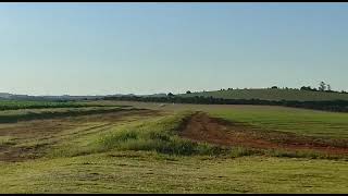 Velocity aircraft landing on a dirt runway