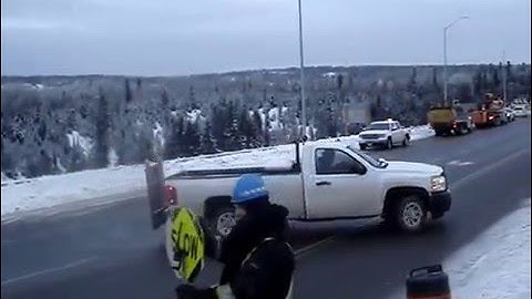 Nipigon river damaged cable bridge traffiic following pilot vehicle