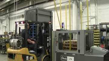 Load Transfer Station with Pallet Dispenser Transferring Wood to Chep Pallet