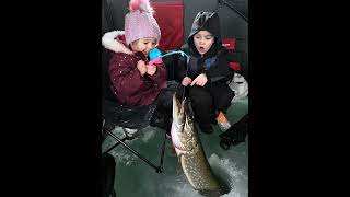 Kids ice fishing in Alaska