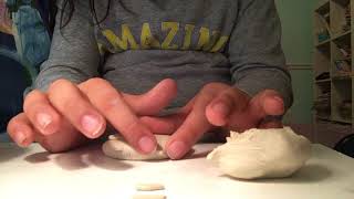 Sculpting a cat out of molding clay