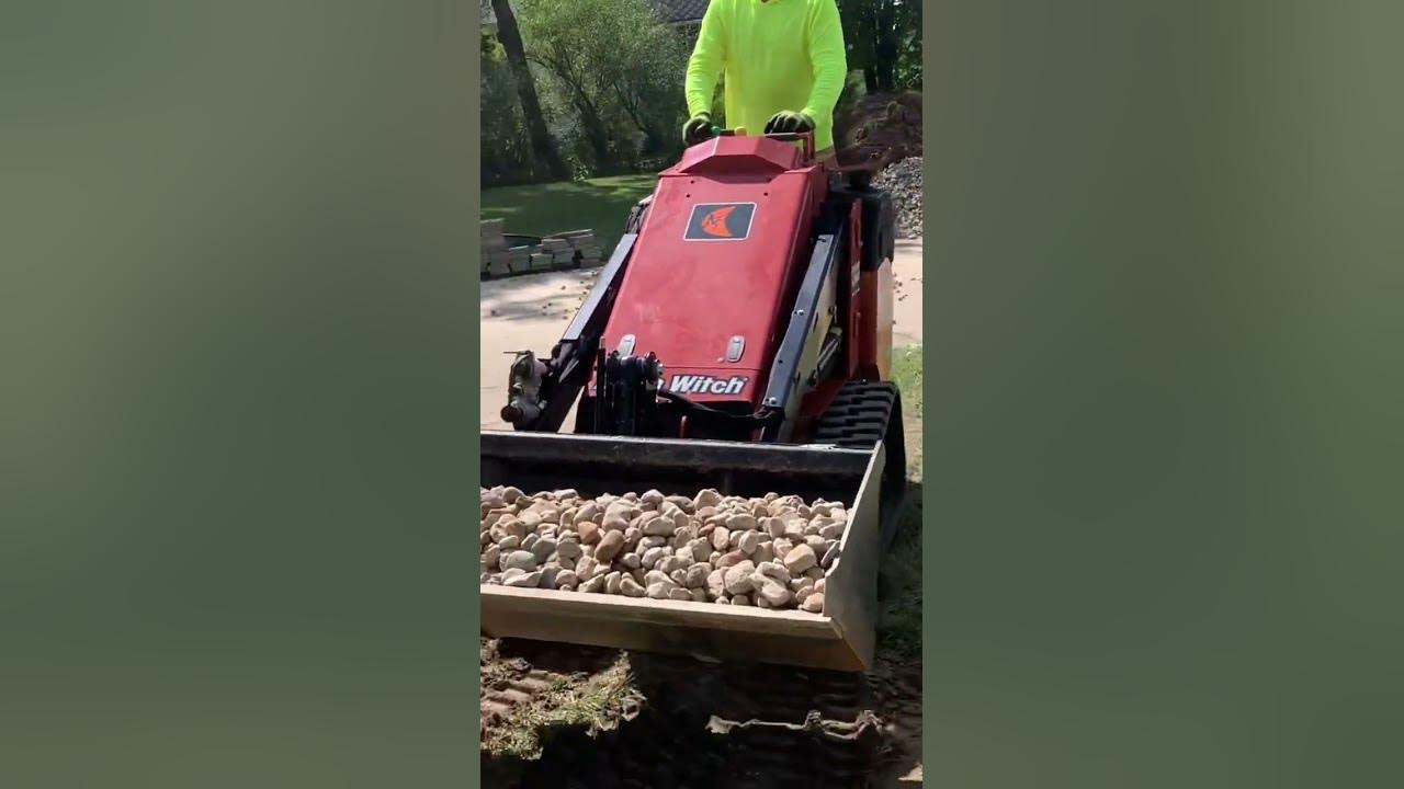 Ditch Witch sk900 moving river rock YouTube