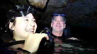 Female Scuba Diver Explores Underwater Cave