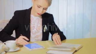 Beautiful Business Woman Works With Tablet