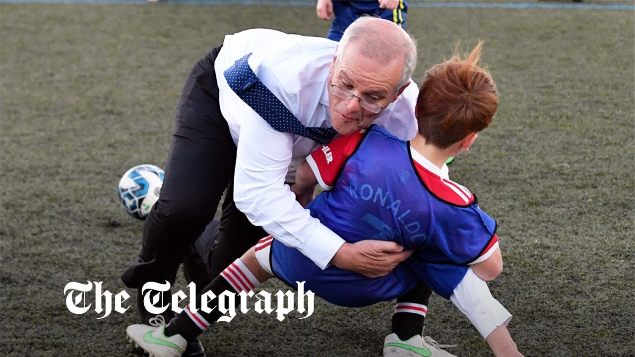 Aussie PM tackles a child in football game on campaign trail YouTube