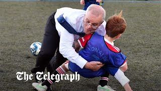 video: Watch: Scott Morrison channels his inner Boris Johnson as he rugby tackles a child