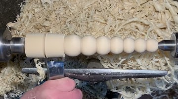 Woodturning bobbin style footstool legs turned with skew chisel by Steve Jones