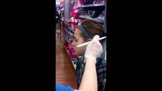 Abby getting her cartilage pearced at Walmart