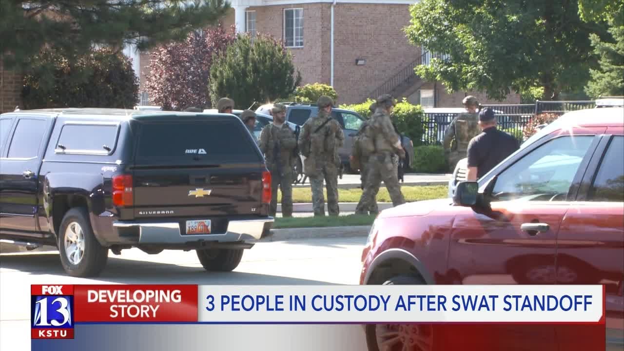 Three people in custody after SWAT standoff - YouTube