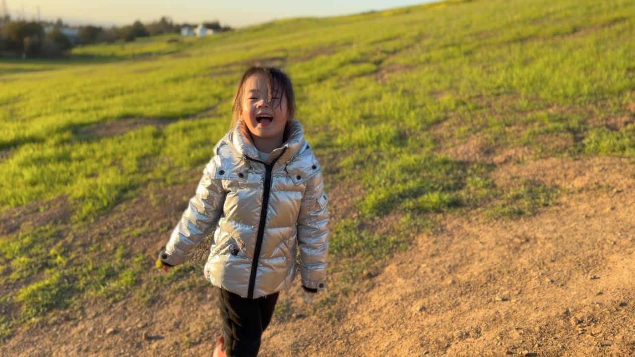 Leia climbs the hill at sunset at Montgomery hills park, San Jose.