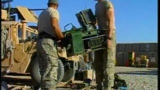 Army Soldiers Salvaging Equipment From A Humvee Damaged During An IED Attack
