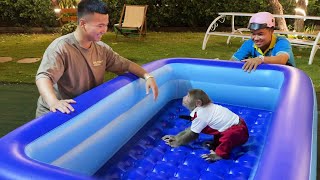 Super surprise! Cutis excited jumped up to received huge swimming pool from dad