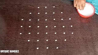 Simple sikku kolam with 7-3 straight dots by Unique Rangoli