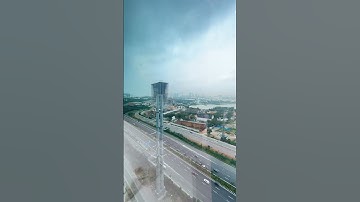 Busy city traffic in motion, showing real-time flow of vehicles and people at a main intersection.