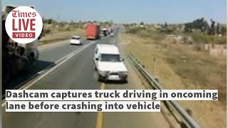 Dashcam captures truck driving in oncoming lane before crashing into vehicle.