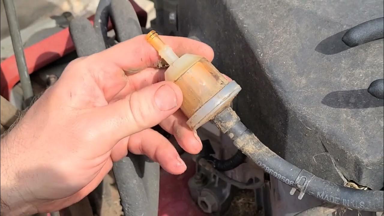 Changing the fuel filter on Exmark Turf Trace Hp. Spring lawn mower