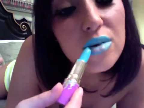 Very descent lady wearing blue lipstick instructing how your should apply i...