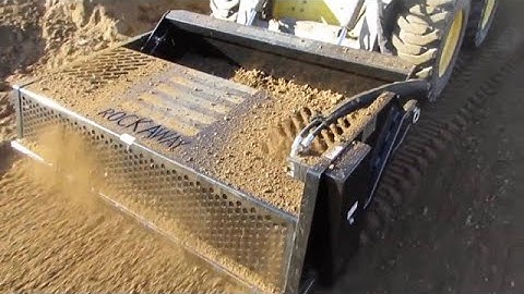 Skid Steer Rock Rake Attachment In Action by Rockaway