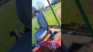raking golf course sand traps