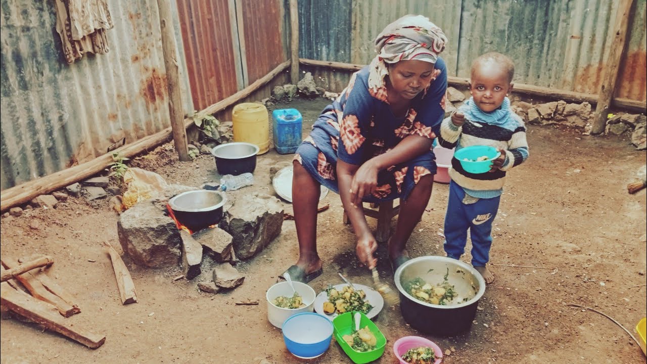 African village life # cooking village cuisine for lunch// kales with Irish potatoes .