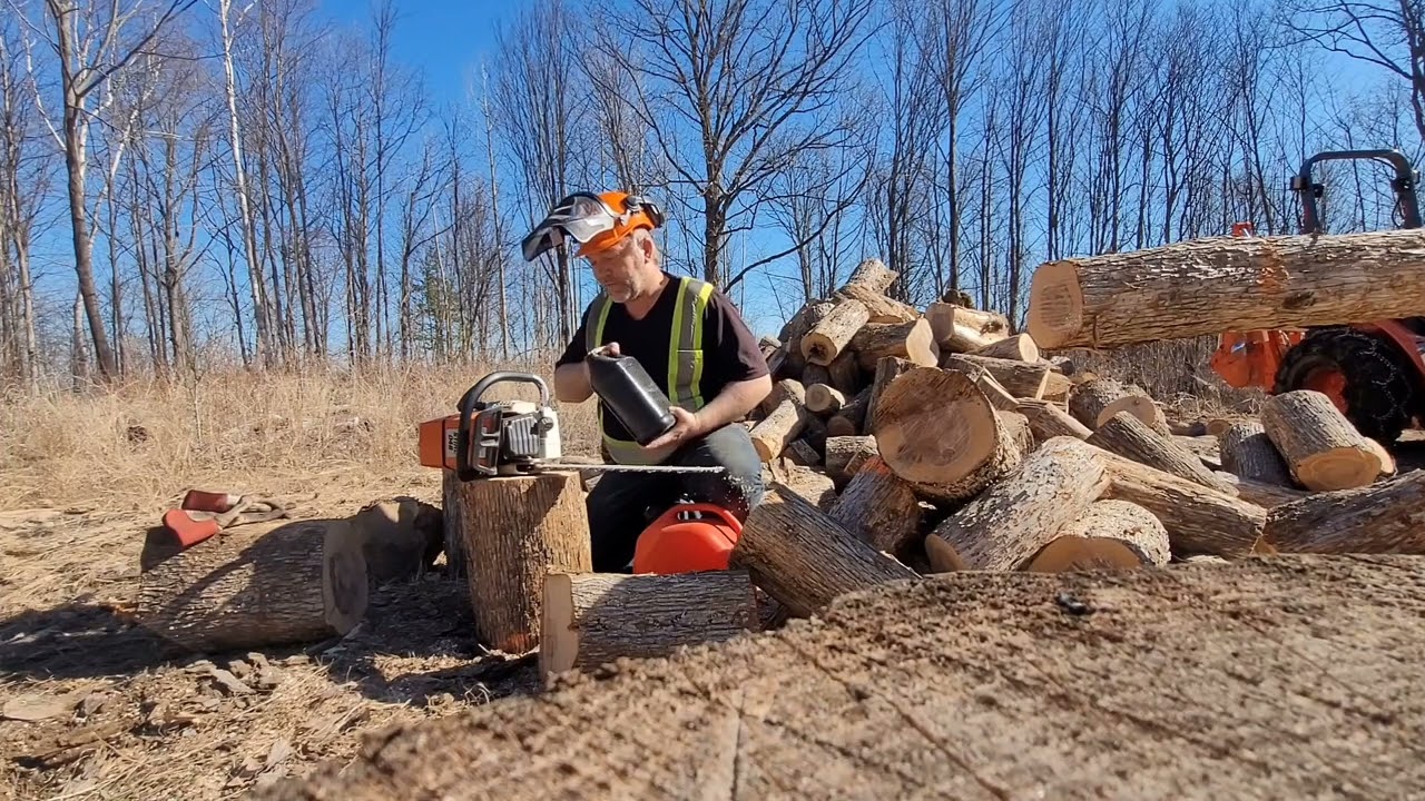 The Kubota B2601 with the HLA 60 inch root rake grapple doing firewood.