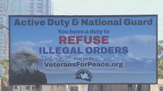 Billboard near naval station causes controversy