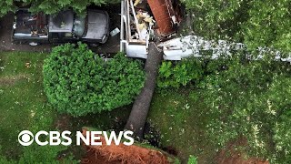 Tornadoes pound Michigan, Maryland, as heat wave strikes the Southwest