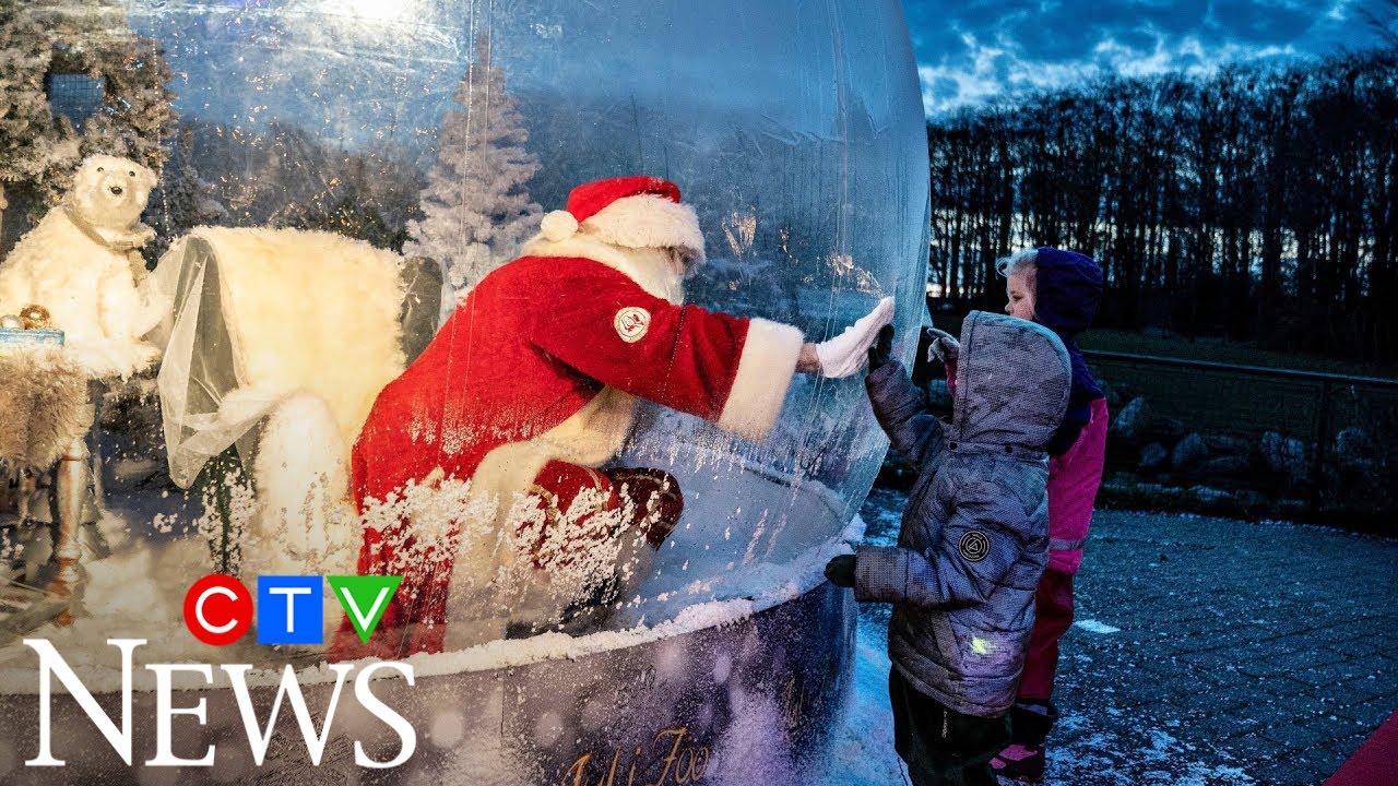 Santa greets kids from inside snow globe in Denmark