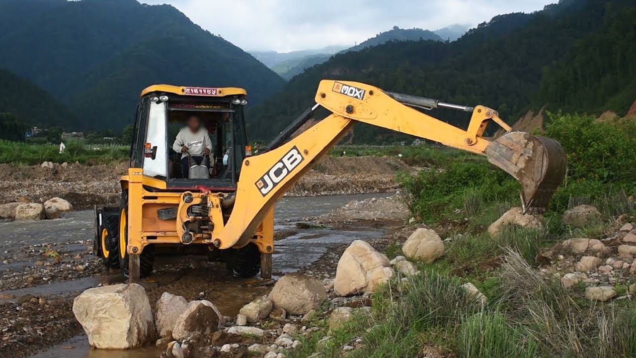 JCB  Excavator Digging Stone From The River
