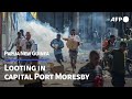 Looting in papua new guineas capital port moresby  afp