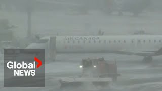 Powerful winter storm grounds flights in Toronto amid power outages, school closures
