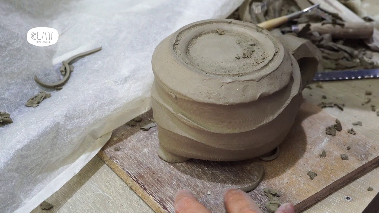 Hand trimming a jug - Pottery Making - Pottery Malaysia