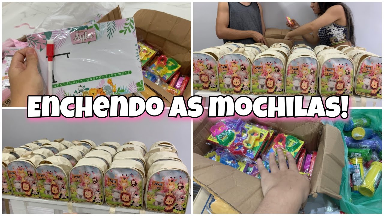 Enchendo as mochilas personalizadas da festa de 1 aninho da ayla.
