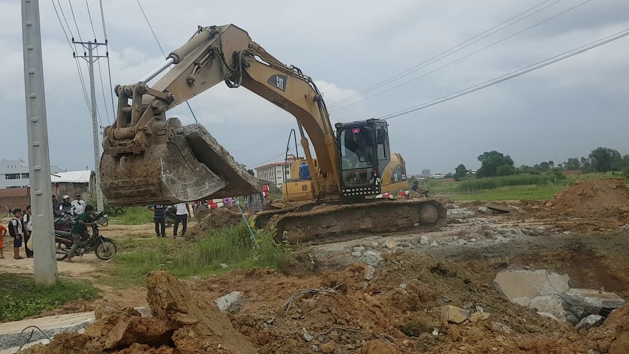 Excavator CAT 320CL Digging Concrete Road - YouTube