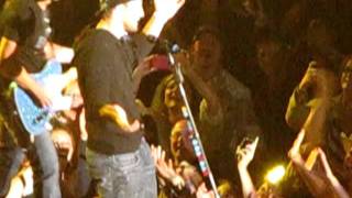 Tim Tebow Singing on Stage with Brad Paisley