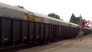BNSF 9014 with empty ore gets beat by BNSF 5084 with westbound autorack Part 1