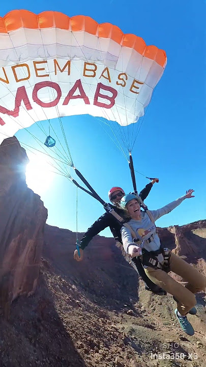 Want to smile? Watch her make a tandem BASE jump into Mineral Bottom Canyon with Tandem BASE Moab