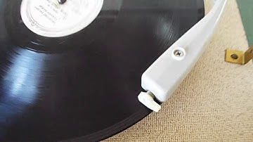 Zenith stereo  record player, manual 4 speed portable playing a 78 RPM 10" record.