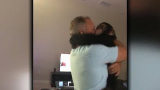 Limbani the chimpanzee greets old caregiver with huge hug
