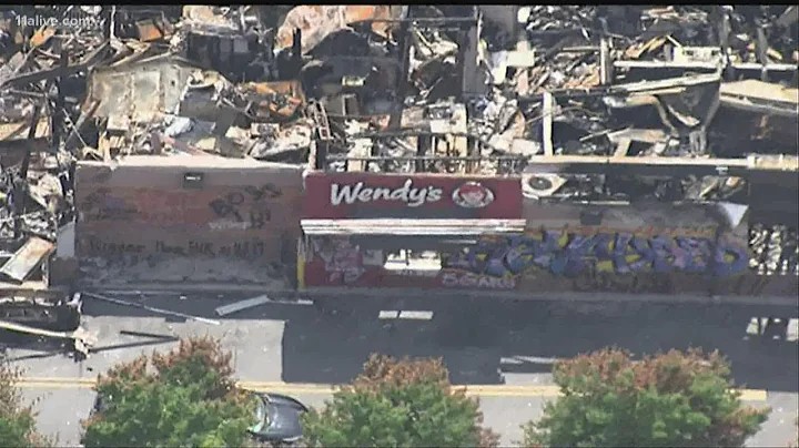Small trash fire set outside Wendy's where Rayshar...