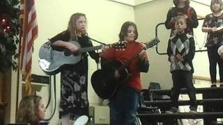 Travis on guitar school Christmas program 12 15 11
