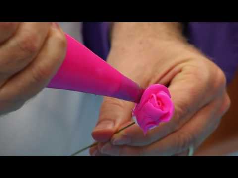 http://globalsugarart.com Chef Alan Tetreault of Global Sugar Art shows you step by step how easy it can be to make beautiful buttercream roses on a bud and on a rose nail. All the supplies...