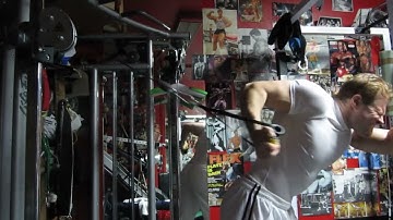Michael Gundill performs high pulley stretch curls for biceps