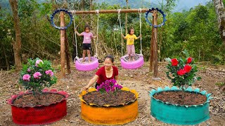 The mother teaches her child to make swings and flower pots from discarded tires | Hoang Huong